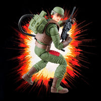 Military action figure in green uniform holding a rifle against a fiery explosion background