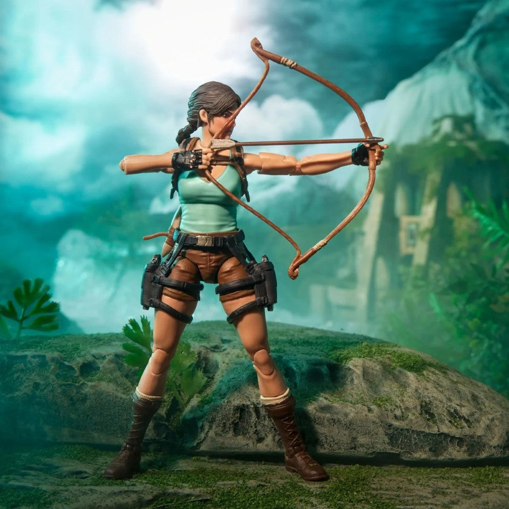 Female adventurer action figure aiming a bow in a lush jungle setting