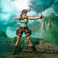 Female adventurer action figure aiming a bow in a lush jungle setting