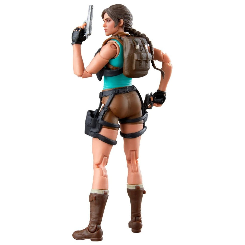Female action figure viewed from behind holding a pistol and wearing a backpack with tactical gear