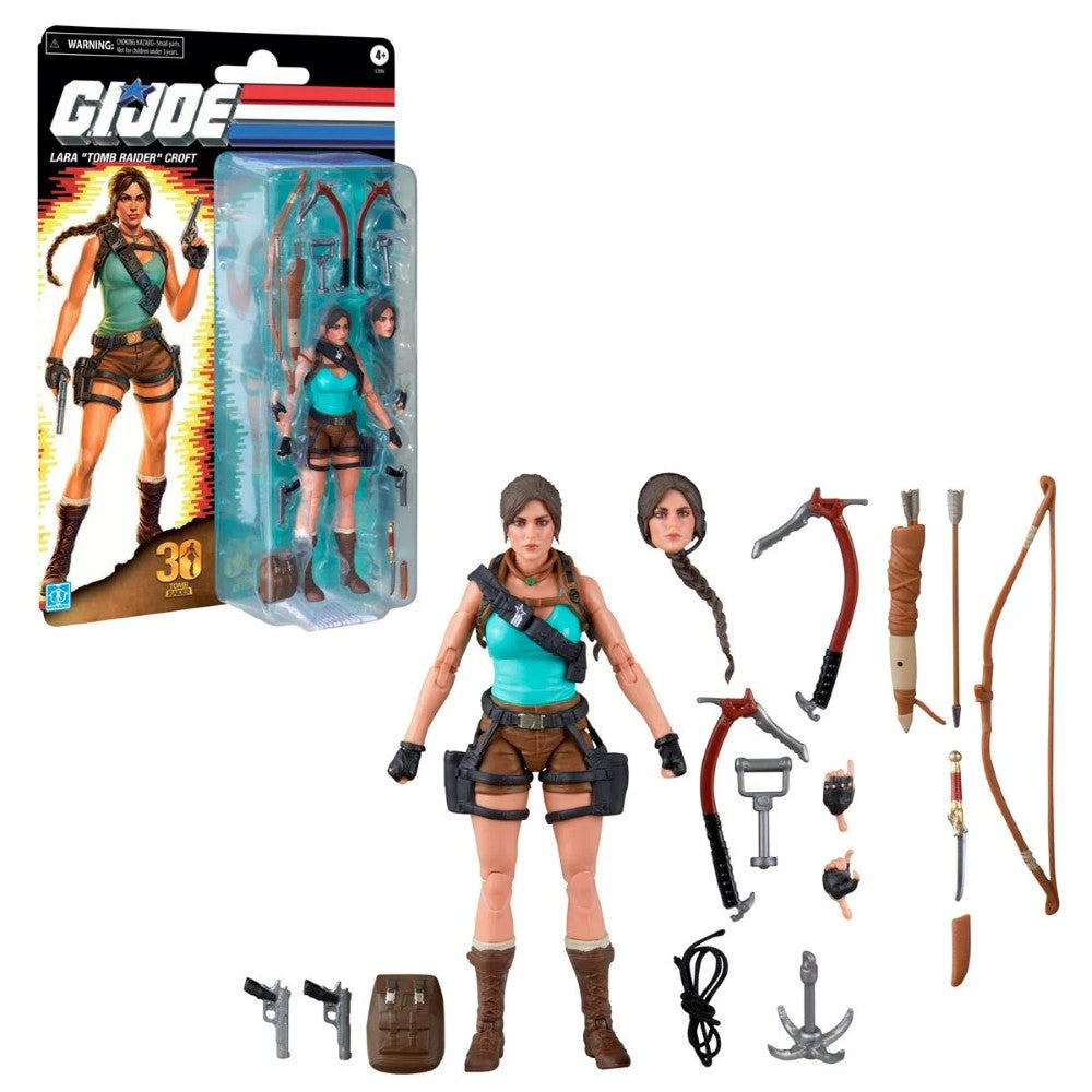 GI Joe Lara Croft action figure with turquoise outfit, packaging, alternate hands, weapons, and accessories