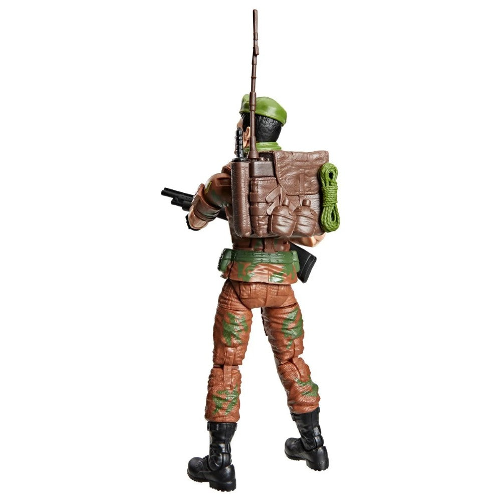 Rear view of a military action figure with a rifle, backpack, green helmet, and brown camouflage clothing