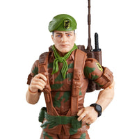 Camouflaged military action figure wearing a green beret and carrying a rifle