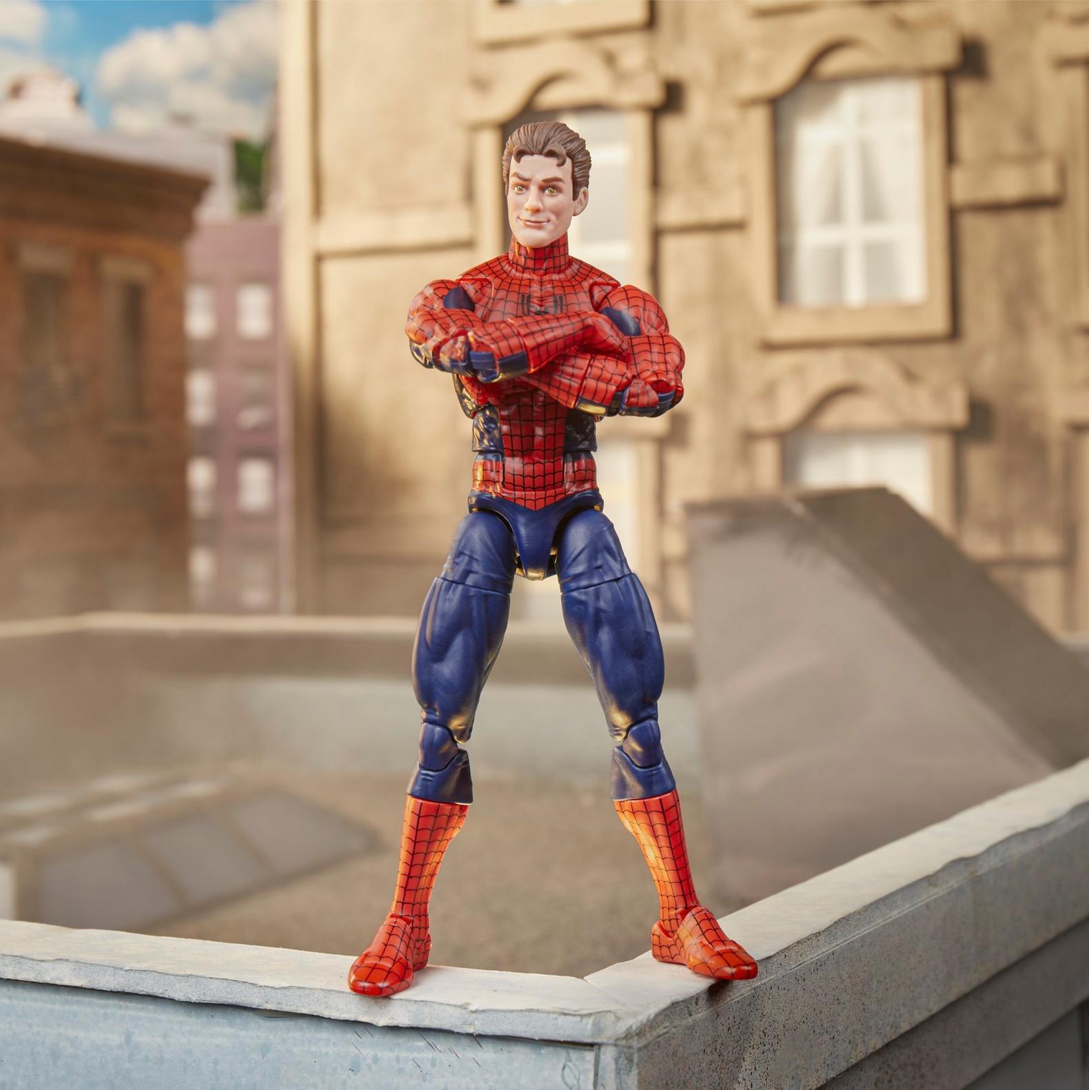 Hasbro Spiderman Marvel Legends Maximum Series 6 inch action figure with unmasked Peter Parker head posed on rooftop edge