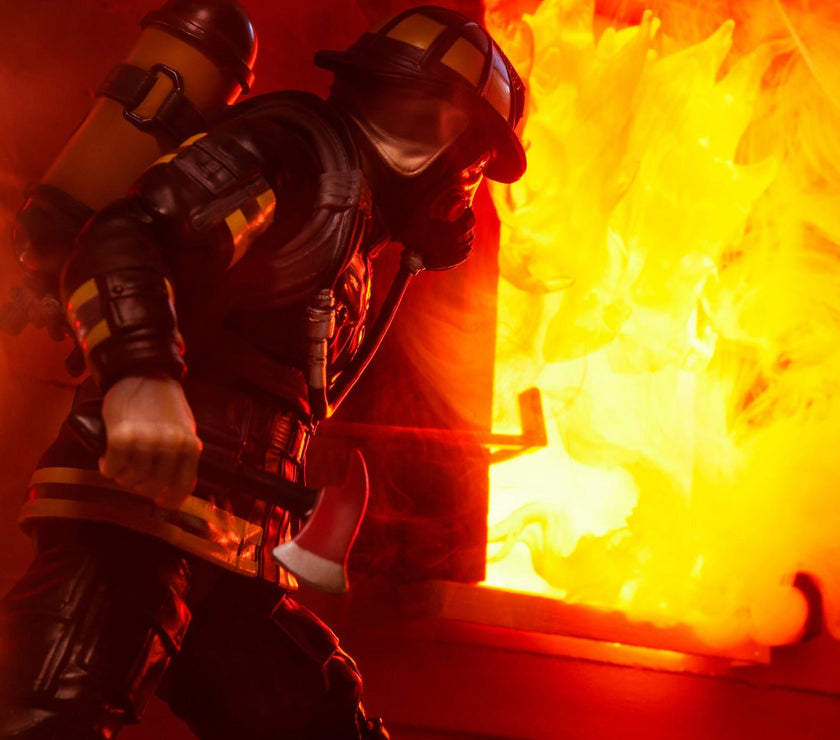 Hasbro G.I. Joe Search and Rescue Firefighter action figure in full gear battling intense flames.