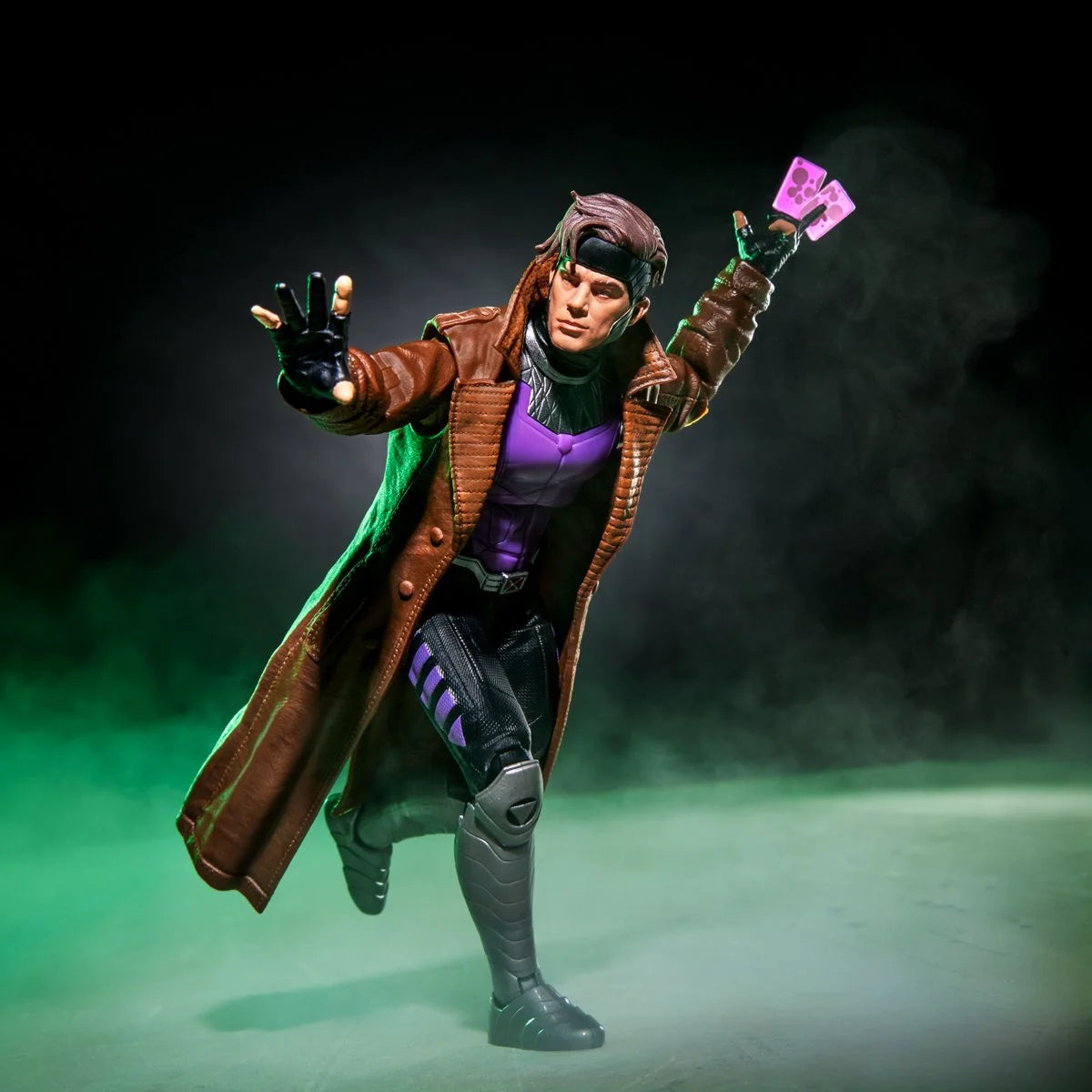 Gambit Marvel Legends Series Action Figure by Hasbro with Bo Staff and Charged Cards 6-Inch posed with glowing cards