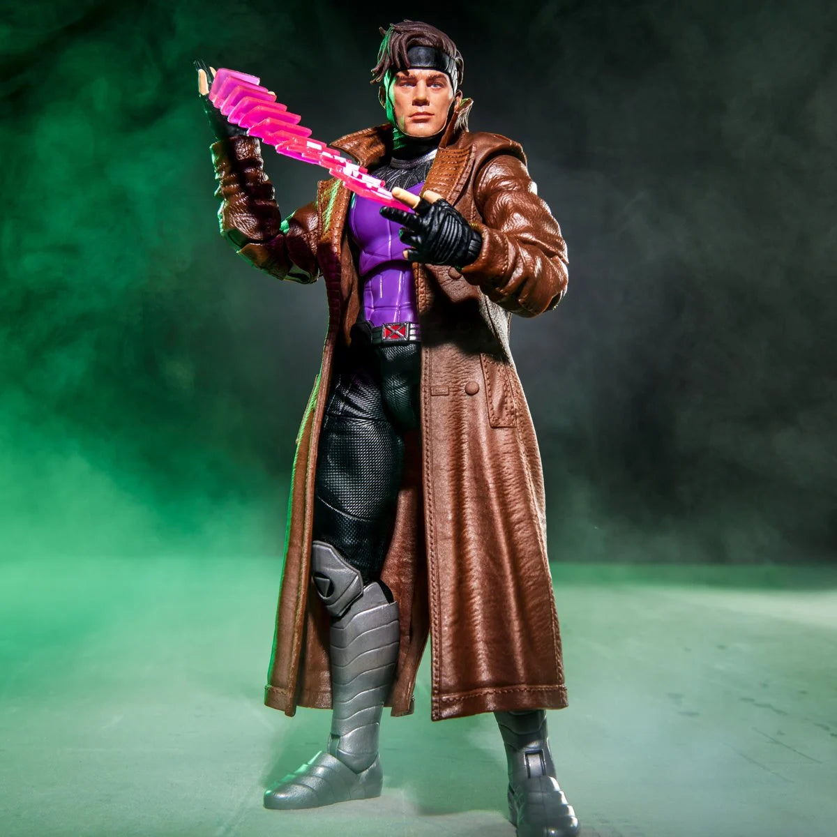 Gambit Marvel Legends Series Action Figure by Hasbro with Bo Staff and Charged Cards 6-Inch holding a pink staff