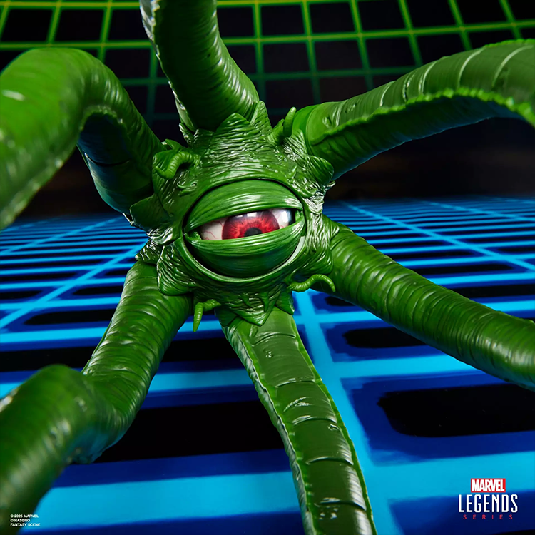 Close-up of Marvel Legends Gamerverse Gargantos figure with detailed green tentacles and a red eye on a retro grid background