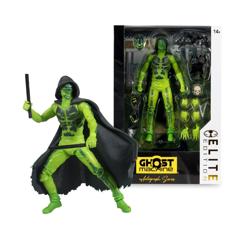 Green masked action figure in a black cape holding a staff beside a boxed matching figure with accessories