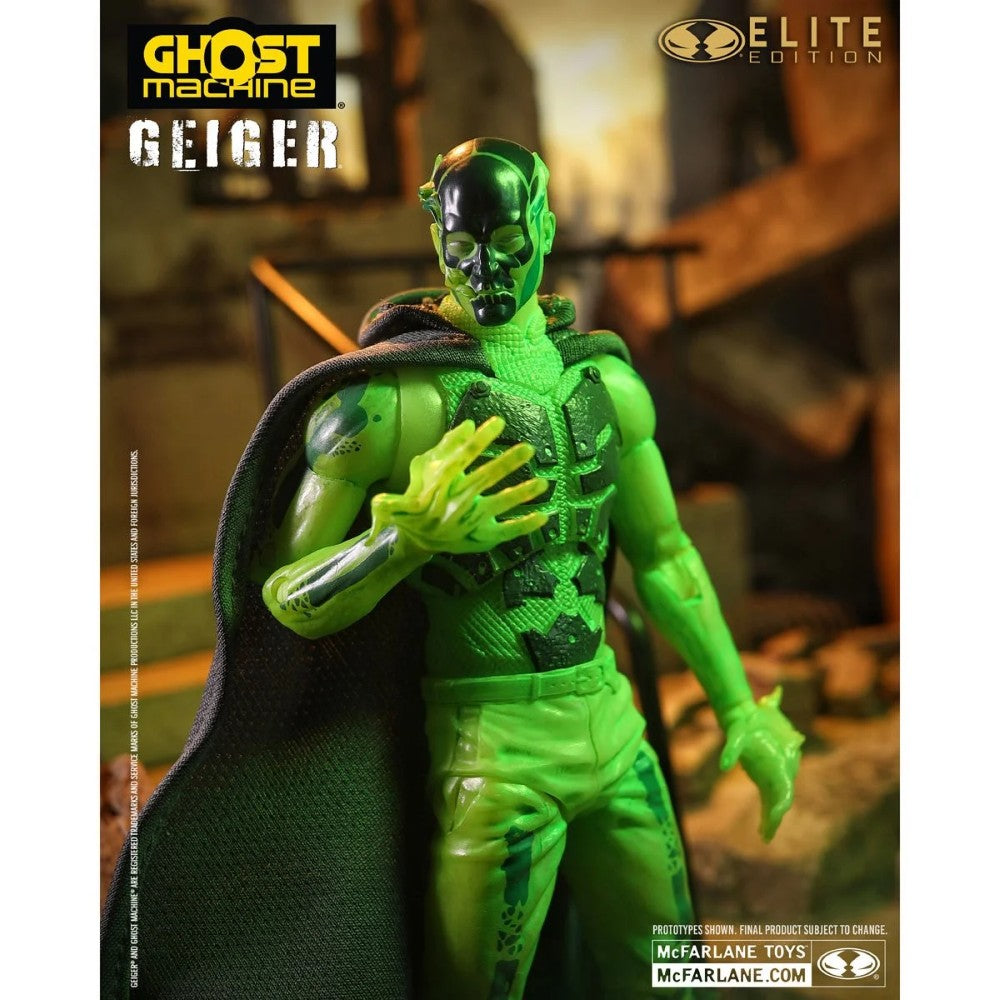 Green Geiger action figure wearing a black cape with Ghost Machine and Elite Edition logos