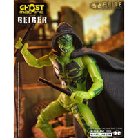 Green hooded Geiger character figure holding two weapons in a detailed industrial setting