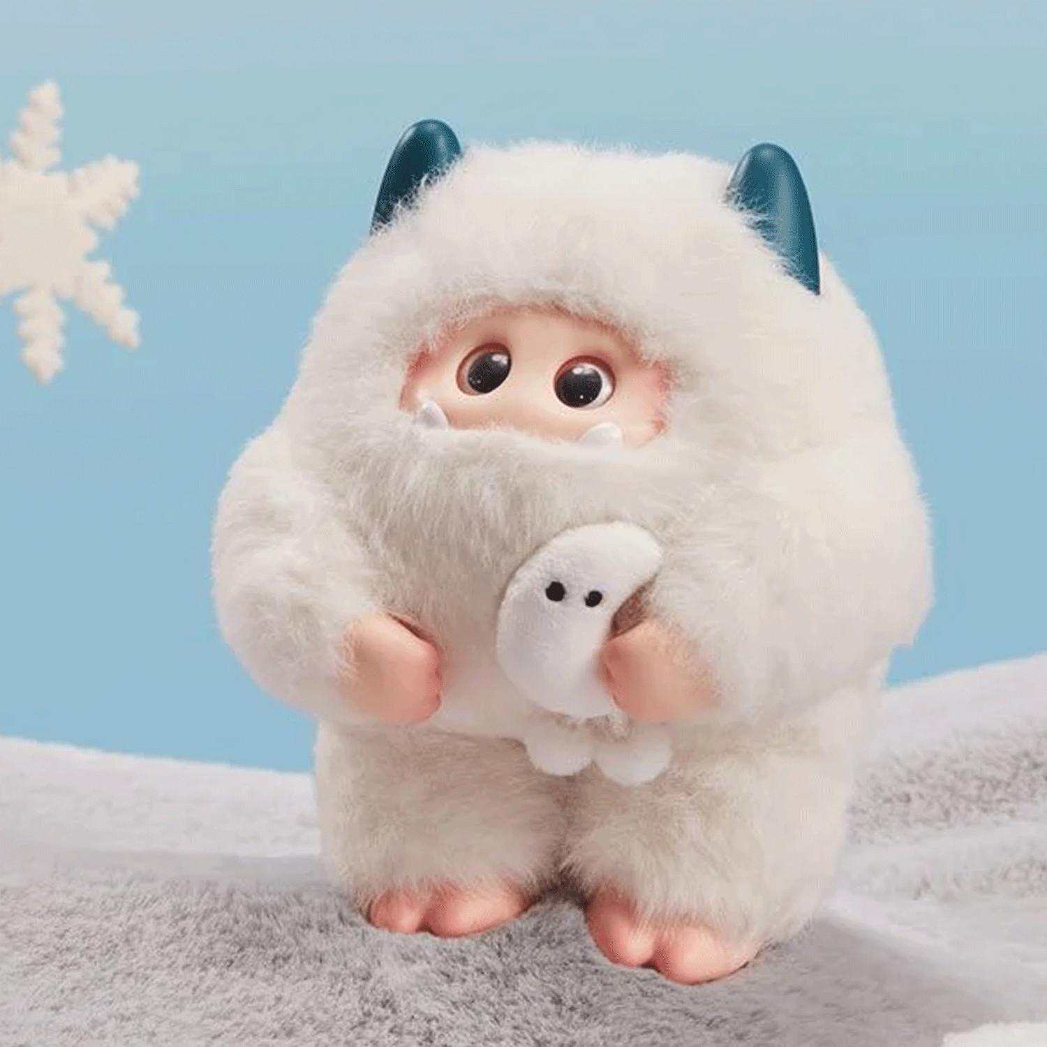 OHKU Giggle Monster Marshmallow Dreams white fluffy vinyl plush with blue horns holding small white ghost figure on soft surface
