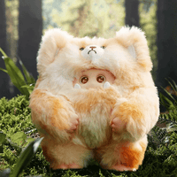 OHKU Giggle Monster plush in fluffy golden bear costume with round eyes and small fangs in forest setting