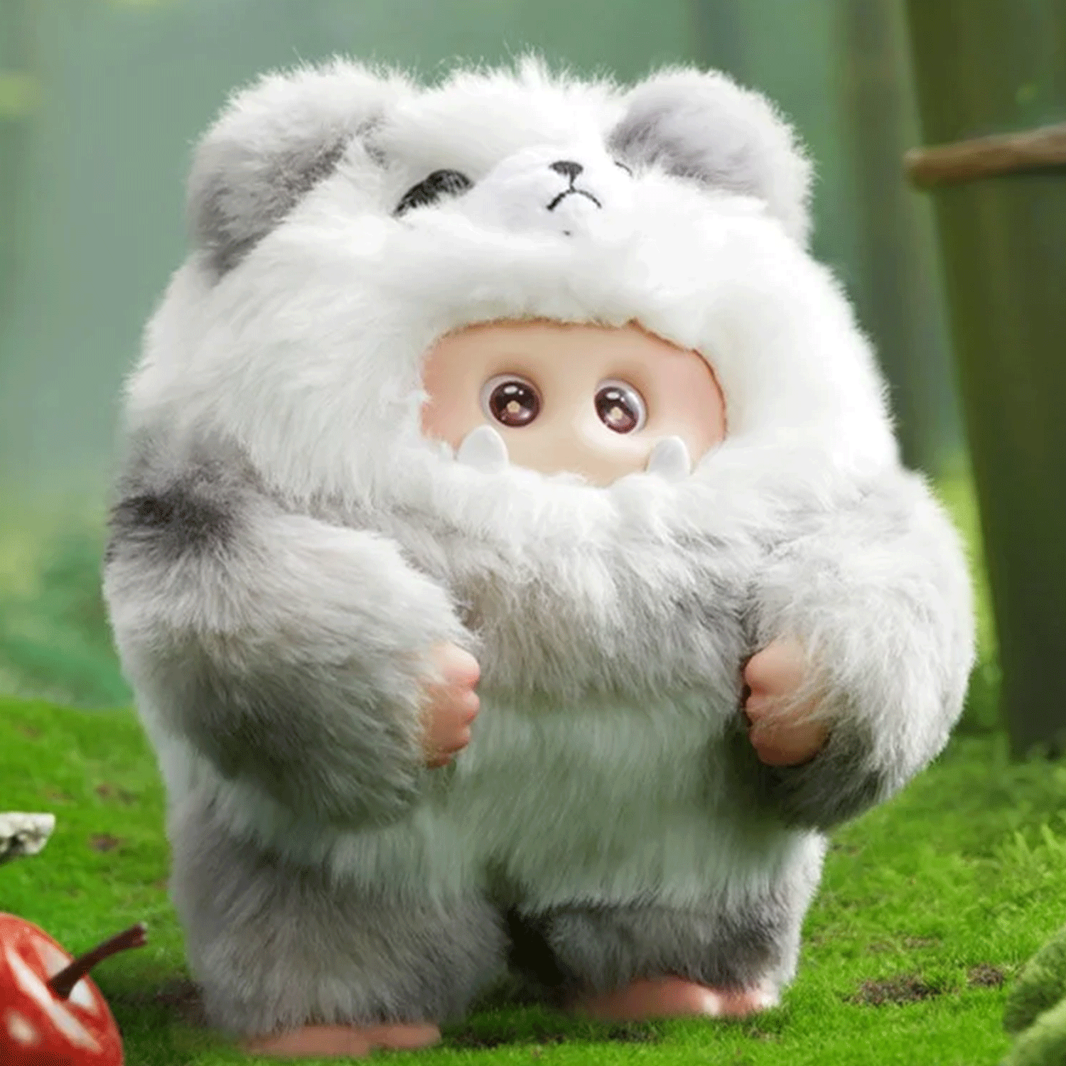 OHKU Giggle Monster Furry Forest plush figure in fluffy gray and white bear-inspired costume on green forest floor