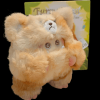 OHKU Giggle Monster plush in soft beige bear costume with wide eyes holding paws in front of Furry Forest box