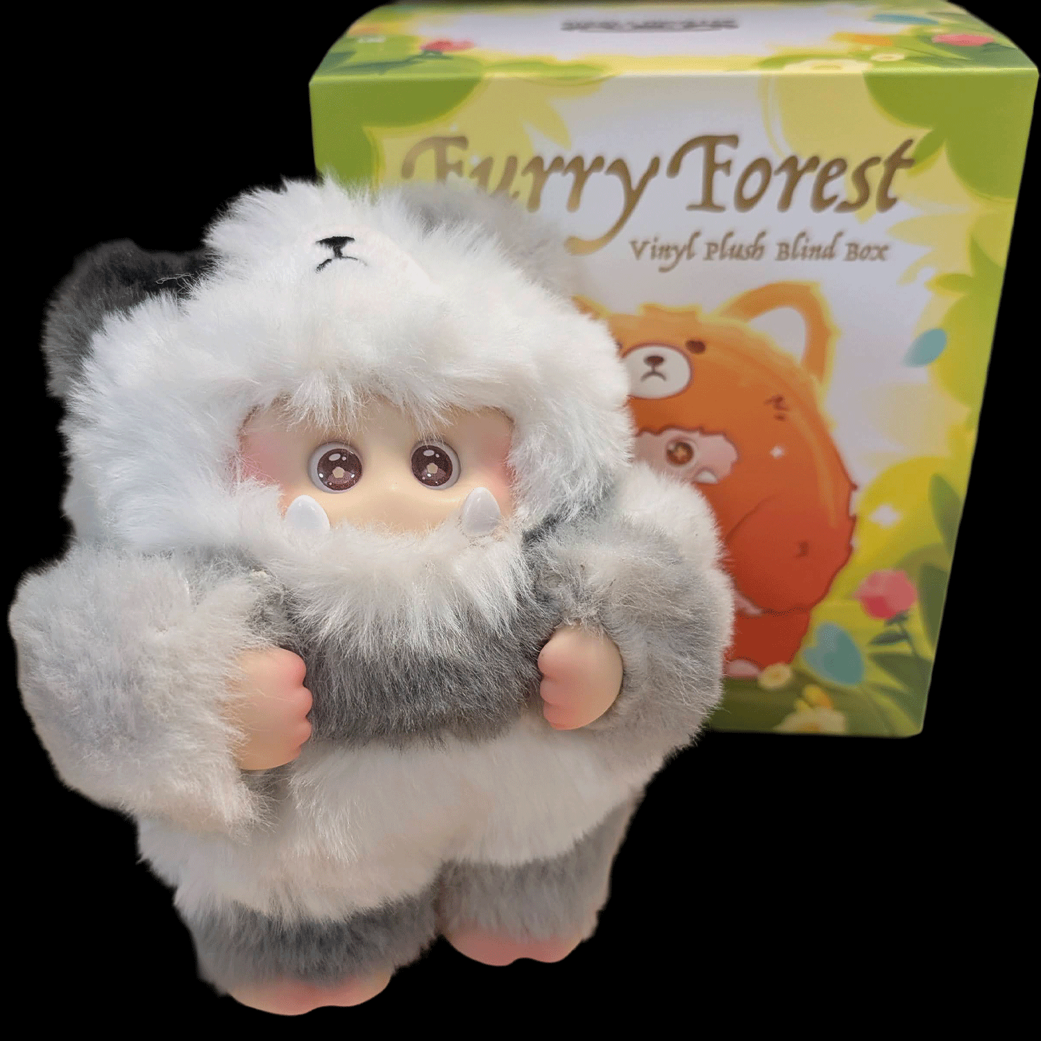 OHKU Giggle Monster plush figure in gray and white fluffy costume with round eyes next to Furry Forest blind box packaging
