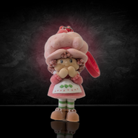 UCC World of Strawberry Shortcake soft flocked mini figure clip wearing pink bonnet and green striped leggings with red clip attachment