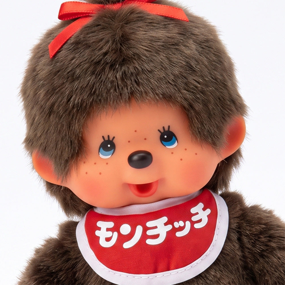 8" Monchhichi Classic BrownGirl in Red Bib with Japanese Character Logo and Blue Eyes by Sekiguchi