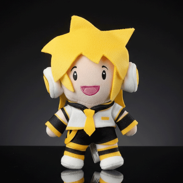 UCC 6-inch Kagamine Len plush with yellow hair, white headset, black and yellow outfit smiling against dark background