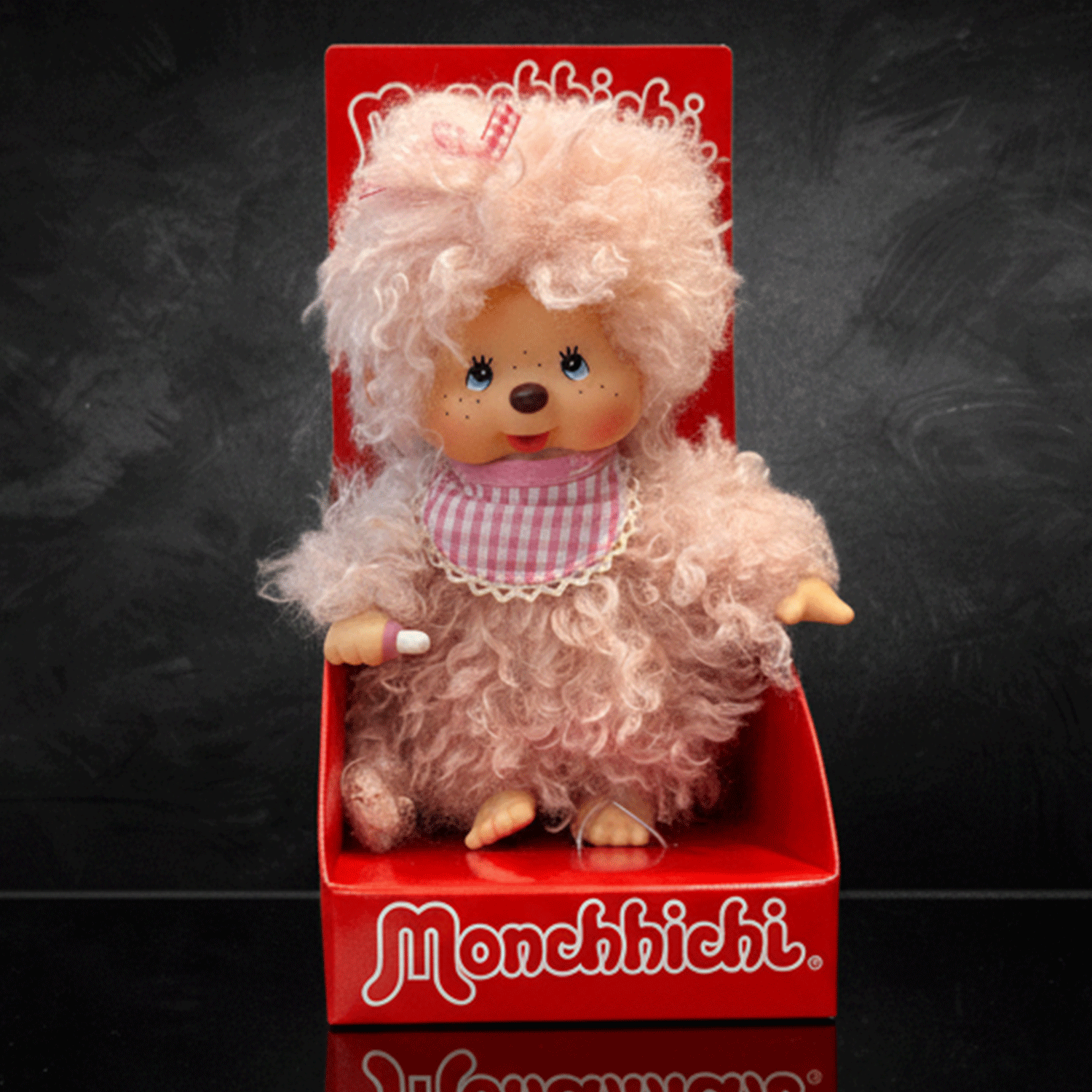 Sekiguchi 8 inch Monchhichi girl doll with fluffy pink beige fur wearing pink gingham bib in red box