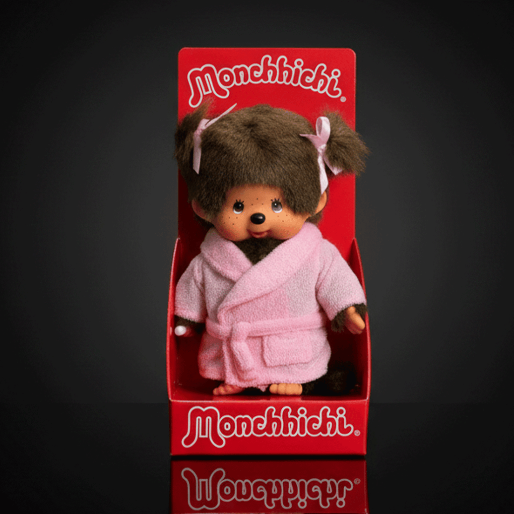 Sekiguchi Monchhichi large plush girl doll wearing pink bathrobe with bows in her hair in red display box
