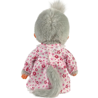 Back view of a gray furry collectible doll wearing a pink floral dress with a tail and tufted hair