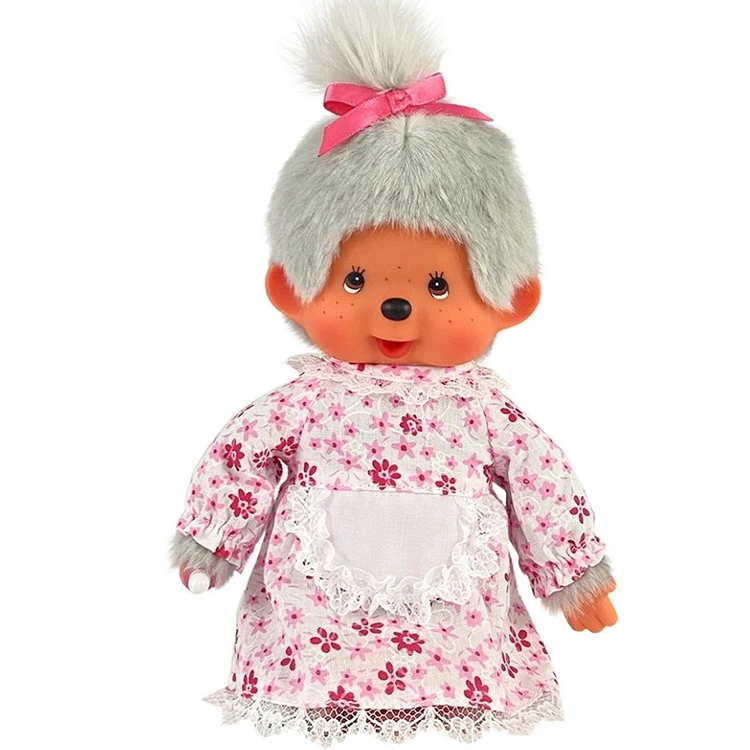 Vintage-style doll with gray fur hair tied by pink ribbon wearing floral dress with lace apron