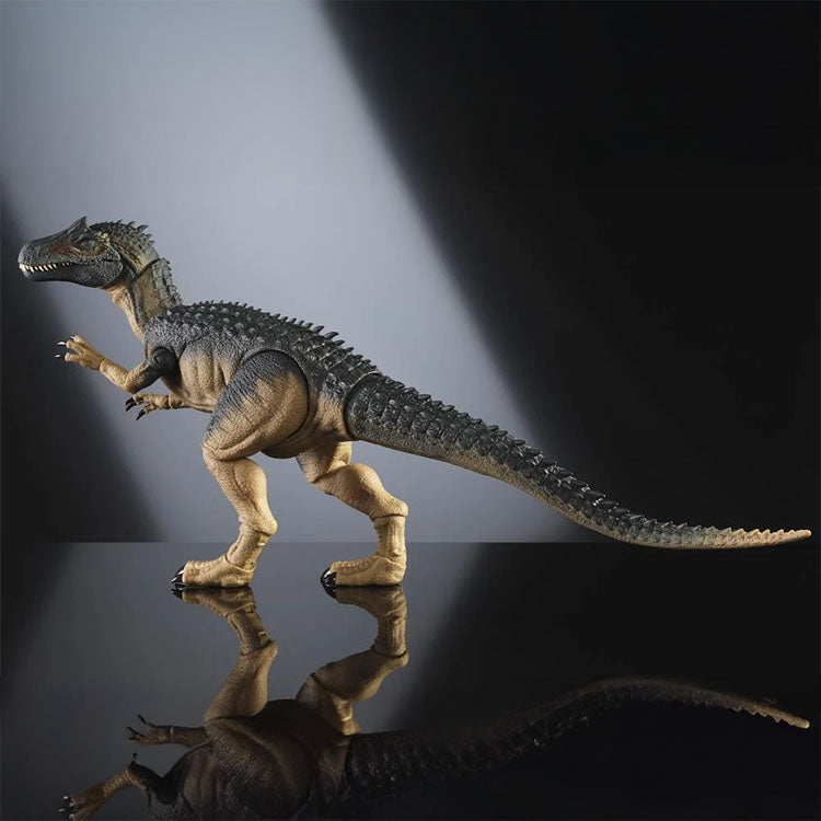 Mattel Jurassic World Allosaurus figure with detailed scales posed on reflective surface against grey background