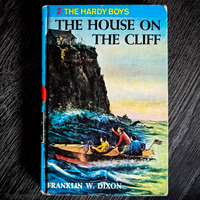 Vintage 1959 hardcover of The Hardy Boys The House on the Cliff by Franklin W. Dixon with blue bar cover art