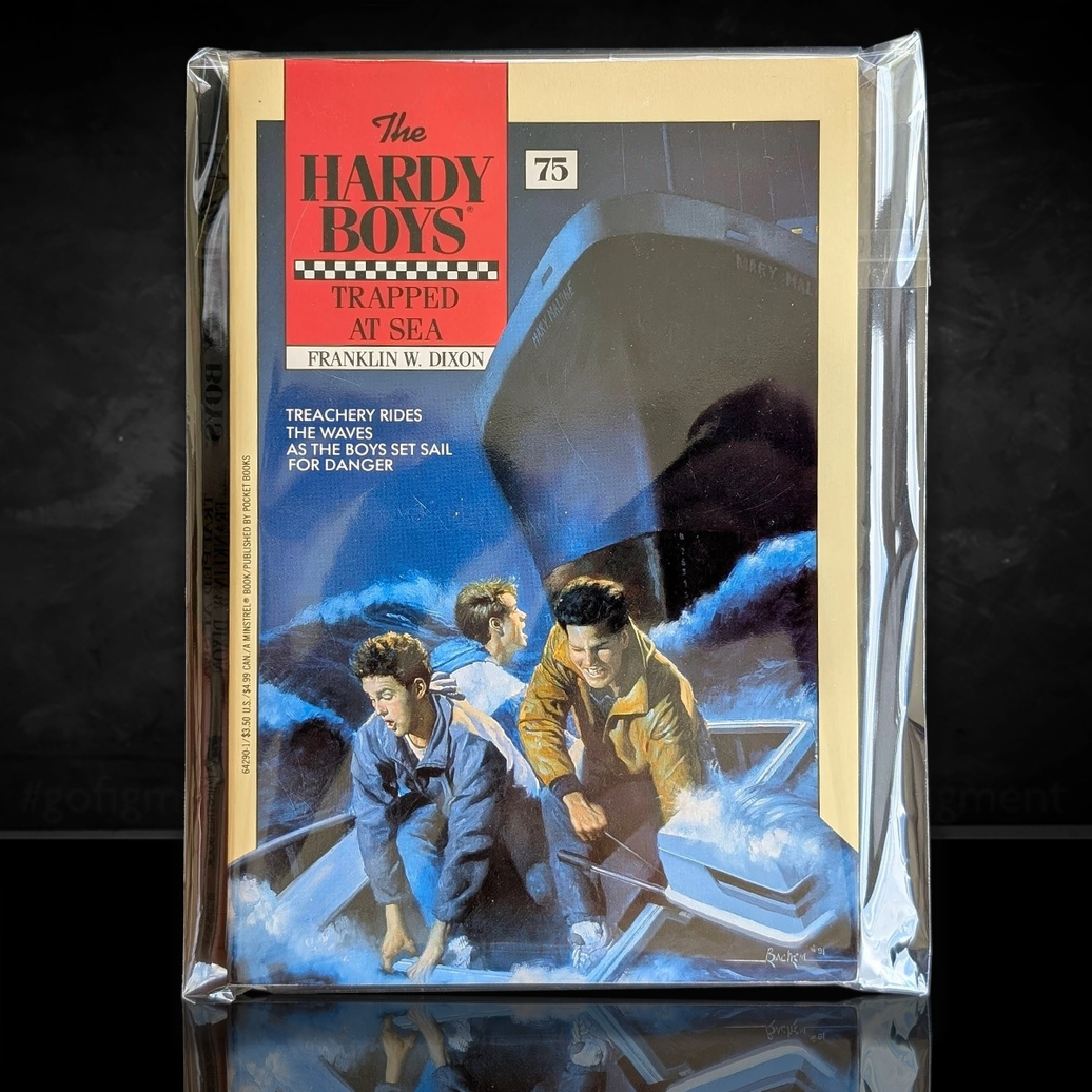 Image of a Hardy Boys Paperback book featuring 75 Trapped at Sea - The Hardy Boys Paperback Book - Vintage 1982