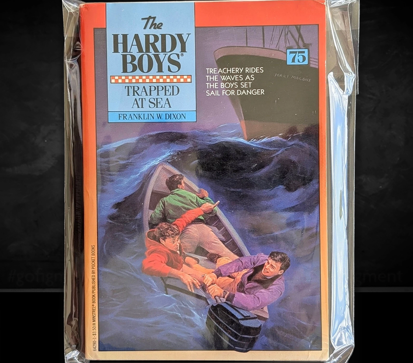 Image of a Hardy Boys Paperback book featuring 75 Trapped at Sea - The Hardy Boys Paperback Book - Vintage 1982