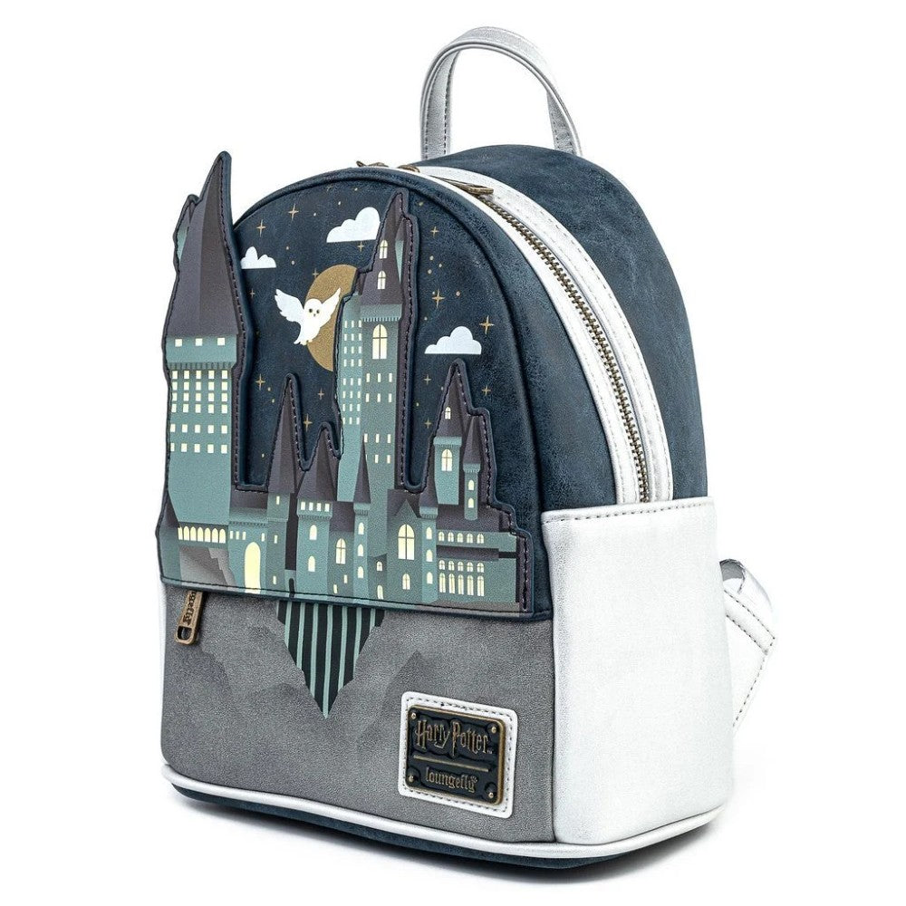 Loungefly mini-backpack featuring Hogwarts Castle with illuminated windows and flying owl on dark starry background