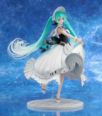 Teal haired female figurine in a flowing white dress displayed on a round stand against a blue background