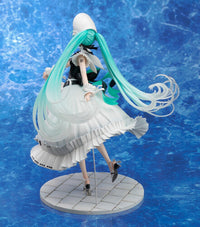 Turquoise haired female character figure in a white dress on a round tiled display stand against a blue background