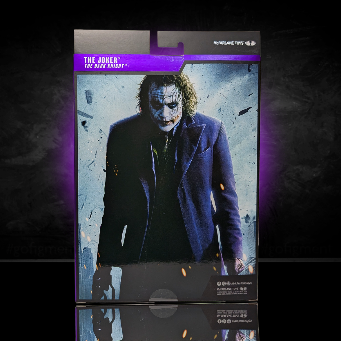 McFarlane Toys DC Multiverse The Dark Knight Joker (Heath Ledger) 7" Action Figure packaging with dark, smoky background.