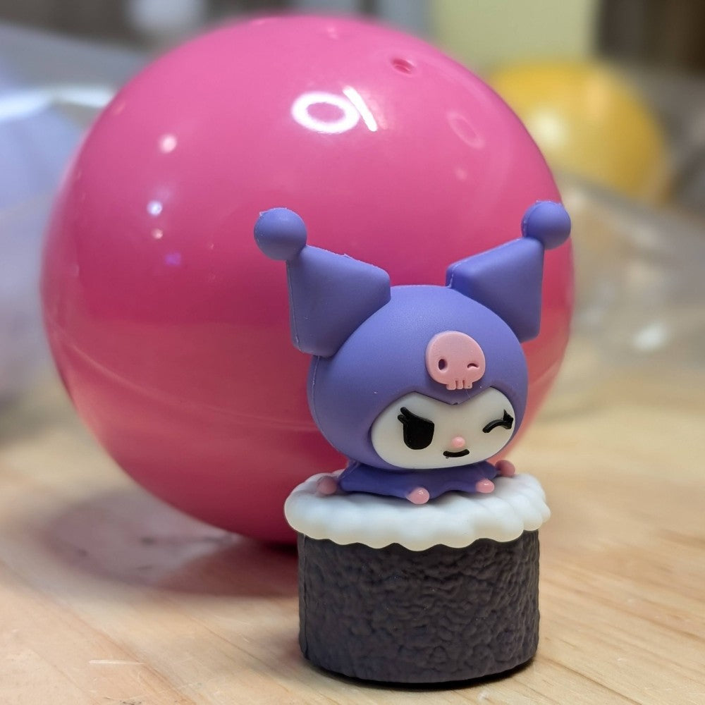Go Figment collectible featuring Kuromi character winking in purple hat atop textured sushi roll base with white topping