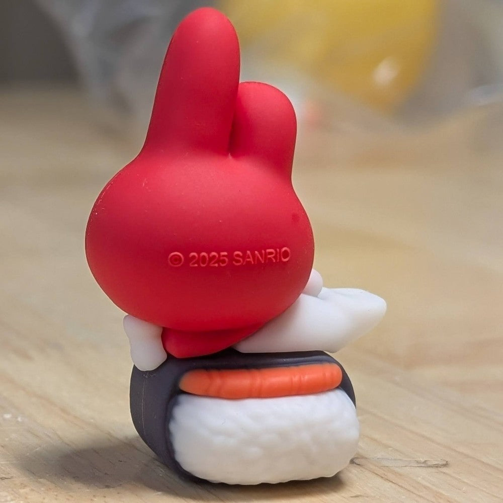 Go Figment Hello Kitty and Friends figure showing My Melody with red hood seated on sushi base from rear view