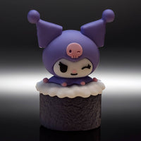 Go Figment Hello Kitty and Friends figure featuring Kuromi character winking atop textured sushi roll base with white topping