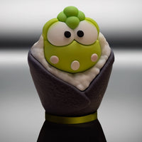 Go Figment collectible featuring green character with large eyes wrapped in dark seaweed sushi cone with rice detail