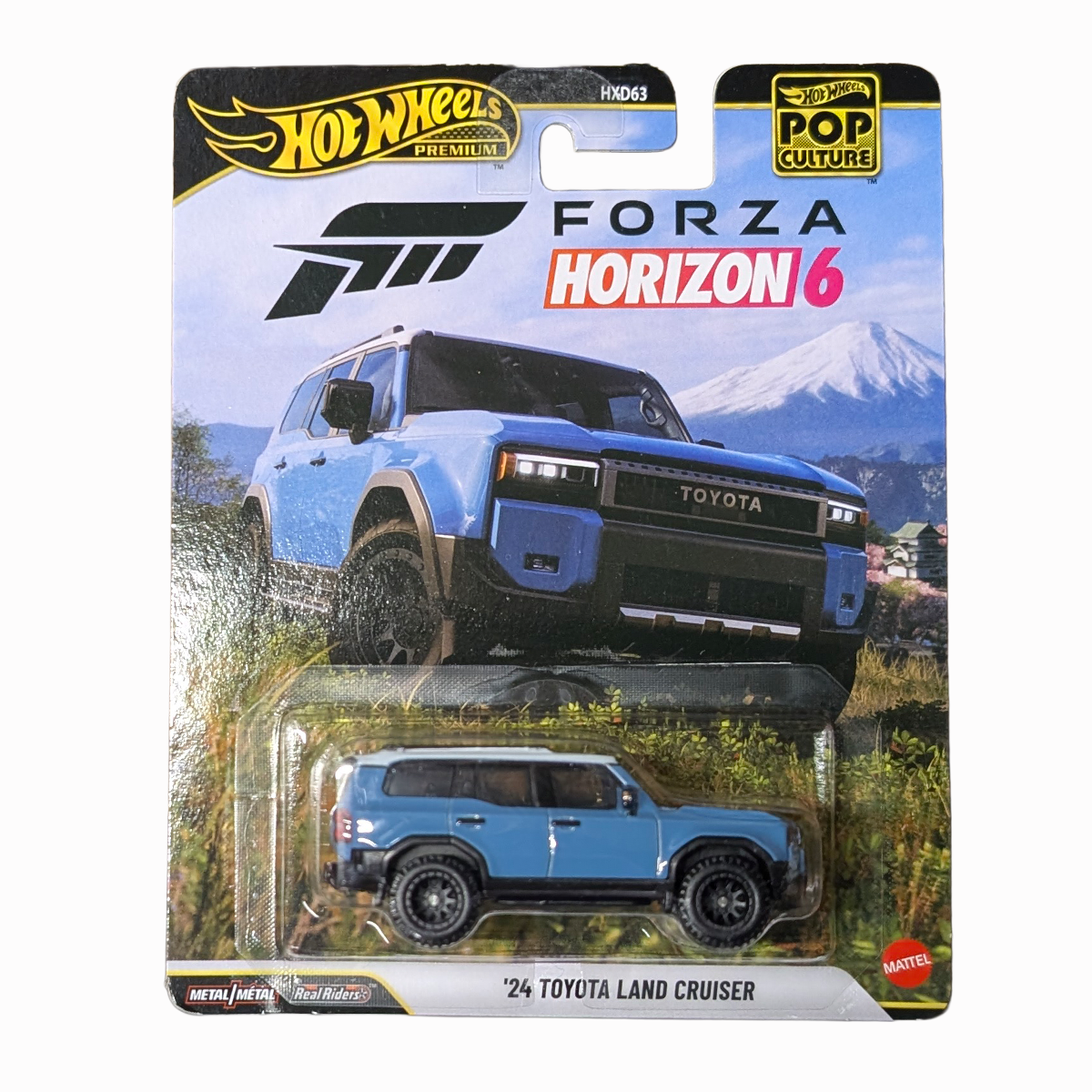 24 Toyota Land Cruiser FORZA 1:64 Hot Wheels Pop Culture Mini-Vehicle by Mattel, blue die-cast SUV in package