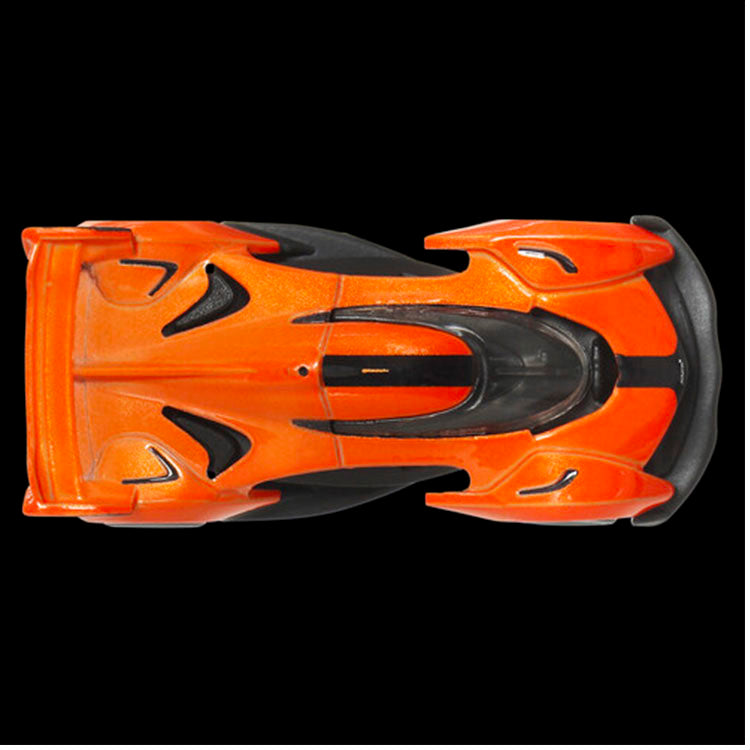 Mattel Hot Wheels Premium McLaren Solus GT model car in vibrant orange with detailed chassis conversion features