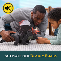 Man and child playing with How to Train Your Dragon Titan Red Death action figure with sound effects on carpet