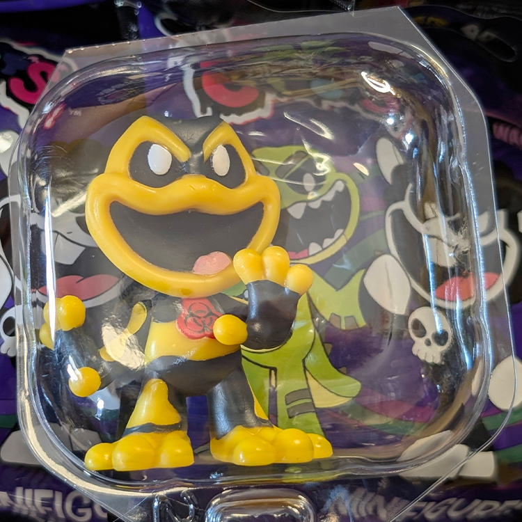 Go Figment Nightmare Critters Poppy Playhouse Series 4 yellow and black mini figure with biohazard symbol in clear packaging