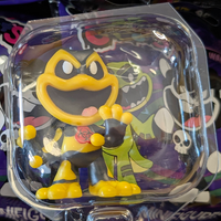 Go Figment Nightmare Critters Poppy Playhouse Series 4 yellow and black mini figure with biohazard symbol in clear packaging