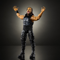 Poseable wrestling action figure in black attire with arms raised against a dark background