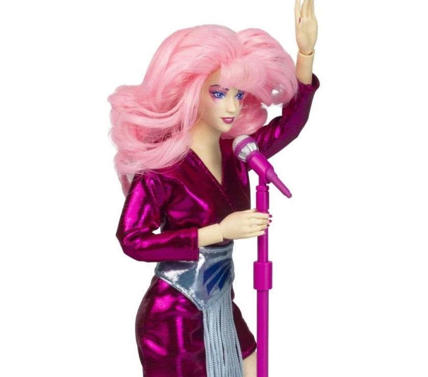Jem and the Holograms 12 inch doll by Loyal Subjects with pink hair and shiny purple outfit holding microphone