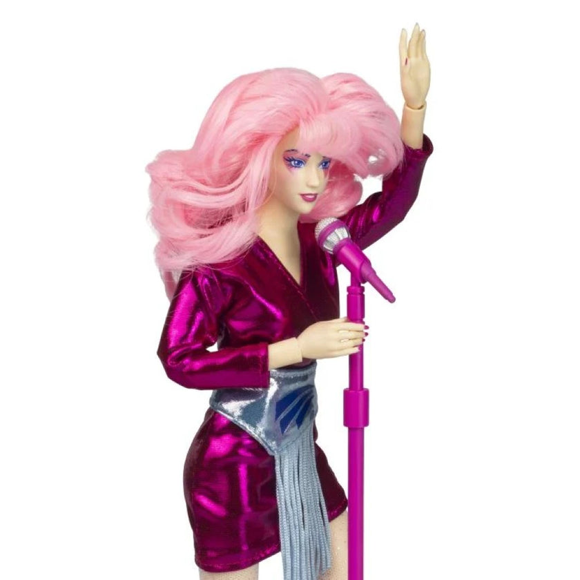Jem and the Holograms 12 inch doll by Loyal Subjects with pink hair and shiny purple outfit holding microphone