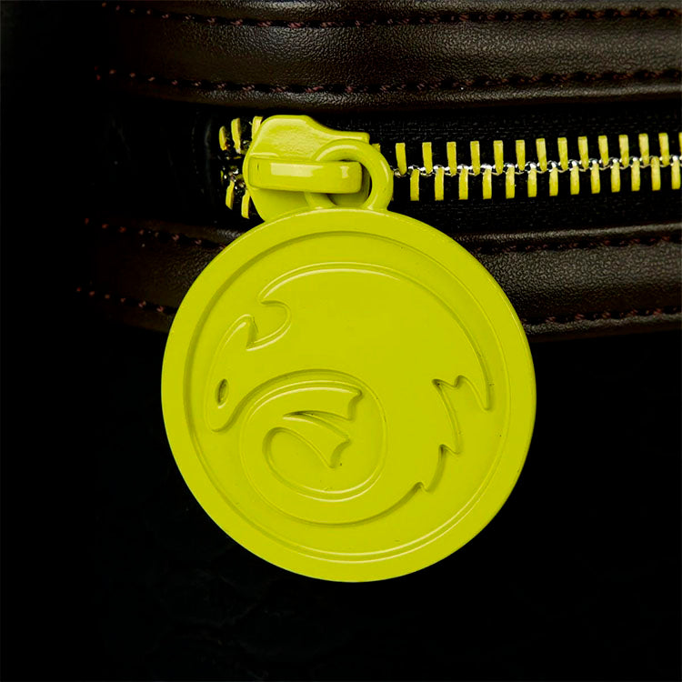 Loungefly How to Train Your Dragon Toothless mini backpack zipper pull with embossed dragon emblem in yellow-green color