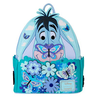 Loungefly mini-backpack featuring Eeyore with butterflies and spinning flowers in blue and purple tones