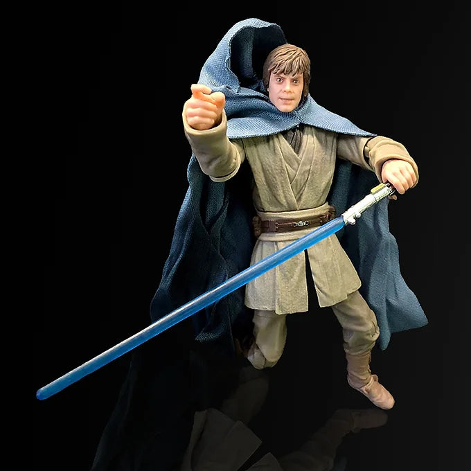 Luuke Last Command action figure posed with blue lightsaber and dark cloak on black background